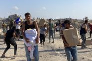 Thousands Rush into New Aid Distribution Center in South Gaza